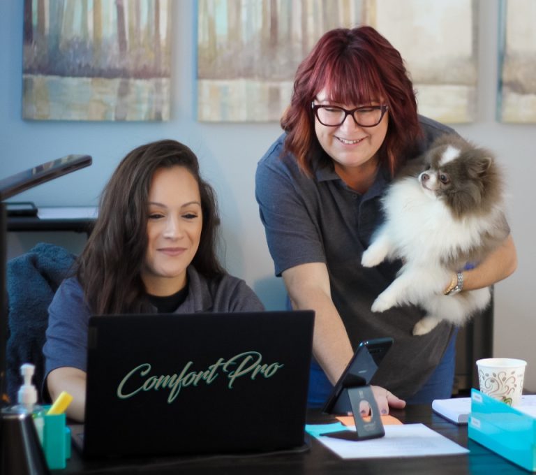 Comfort Pro office team assisting customers with HVAC scheduling and support, showcasing friendly local service in Cary and the Triangle.