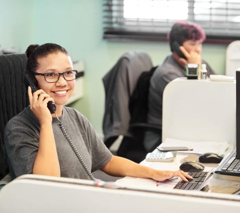 HVAC office staff scheduling heating and maintenance service calls