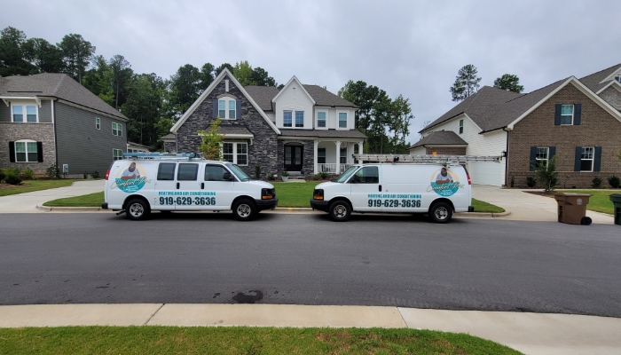 Comfort Pro Service Vans Outside Home In Holly Springs For Ac Installation